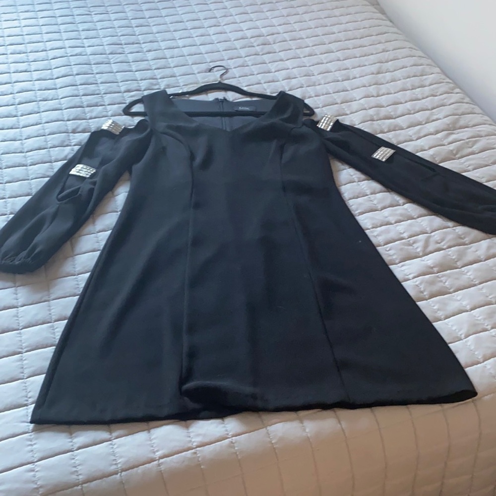 Elegant black dress with crystal sleeve detailing.